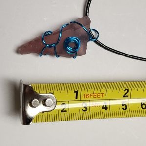 Handmade wire wrap glass pendant with cord.